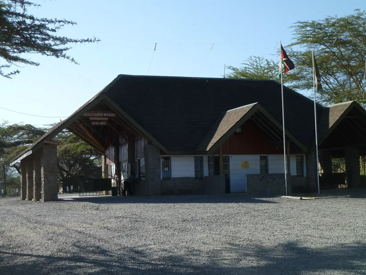 Entrance building with a shaded roof and flag at Elsa Gate of Hell's Gate