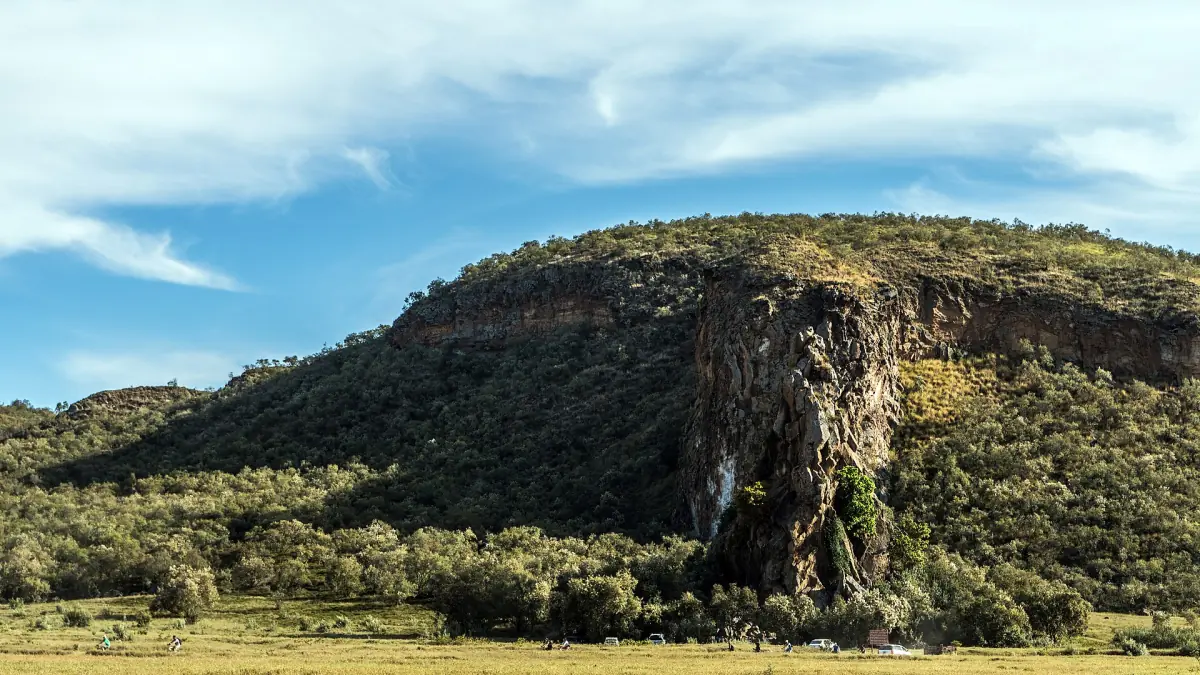 Rock tower and cliff on a bush-covered hill in Hell's Gate National Park